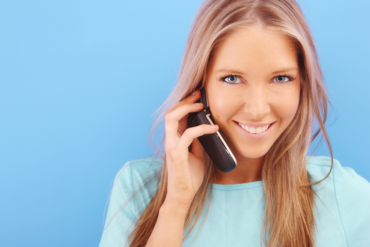 Pretty girl smiling and talking on the phone